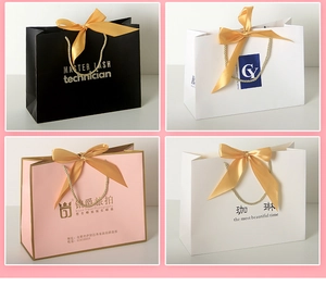 Detail showing gift bags with ribbon bows, metallic handles and custom foil stamping