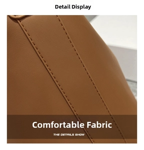Detail view of premium caramel brown faux leather tote showing double stitched seam quality