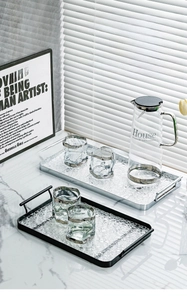 Detail of luxury rectangular tray with water ripple texture and dual metal handles