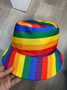 Close-up of a double-sided rainbow striped bucket hat with colorful fabric and neat stitching