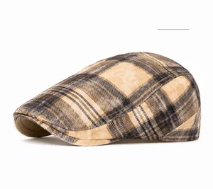 Close-up of the khaki plaid pattern and wool-like texture on a retro British flat cap
