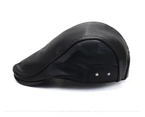 Side view of black faux leather flat cap with silver decorative buckles and stitching