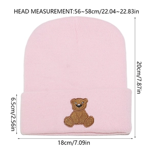 Pink winter beanie cap featuring bear embroidery and detailed size specifications