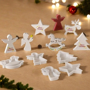 Detailed set of Christmas cookie stamps featuring reindeer, angel, and tree shapes
