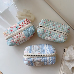 Quilted floral and plaid cotton cosmetic bags with zipper closure and French style labels