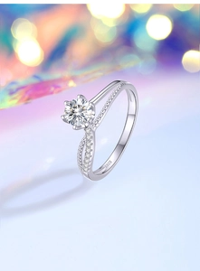 Detail of S925 sterling silver ring featuring a six-prong moissanite and twisted band