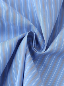 Detailed macro view of the blue striped fabric texture showing weave and soft draping