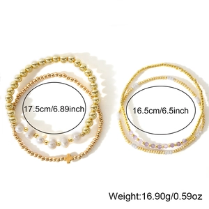 Multilayer gemstone bead bracelet set with cross pendant and pearls on white background