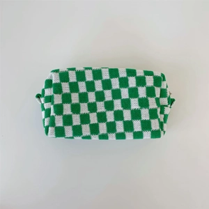 Green and white checkered knit makeup bag with zipper closure on white background