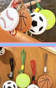 Detail view of cute sports ball coin purses like soccer, basketball, and baseball.