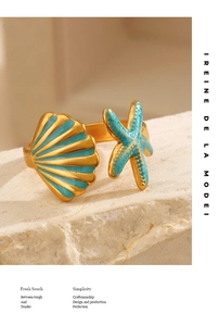 Adjustable gold sea star and shell ring with turquoise enamel inlay on textured stone