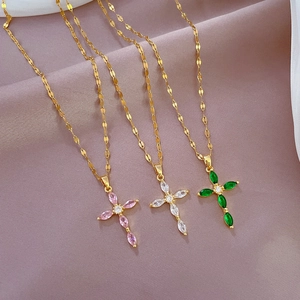 Luxurious gold cross necklaces with marquise-cut gems in pink, white, and green crystals
