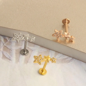 Star-shaped surgical steel labret earrings with sparkling zircons in silver, gold and rose gold