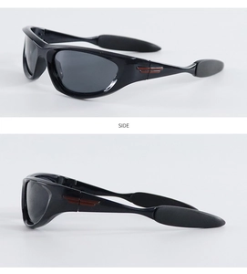Side view of black Y2K sports sunglasses with distinctive red stripes on the temples