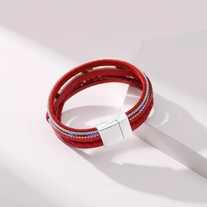 Close-up of red multilayer bohemian leather bracelet with silver magnetic buckle