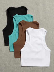 Detail of ribbed knit fabric texture on multiple slim fit racerback yoga crop tops