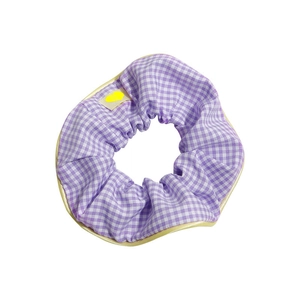 Purple checkered scrunchie with yellow heart tag and contrast piping on white background