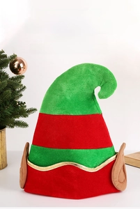 Close-up of velvet elf Christmas hat with red green stripes and decorative gold trim