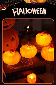 Set of four LED glowing orange pumpkins and a large decorative jack-o-lantern for Halloween