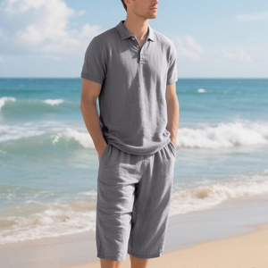 Men's grey linen polo and shorts set shown in a relaxed beach setting for summer