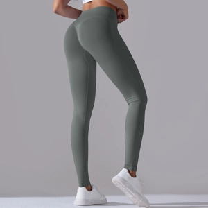 Detail view of seamless dark grey yoga leggings with high waist and push-up effect