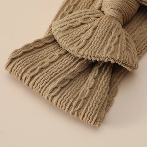 Macro shot of high-quality knitted jacquard nylon fabric with soft bow detail for baby headband