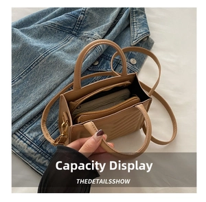 Interior view showing large capacity for long wallet in quilted brown leather crossbody bag