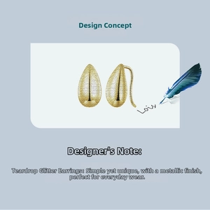 Detail view of gold teardrop earrings featuring a brushed metal texture and vertical patterns