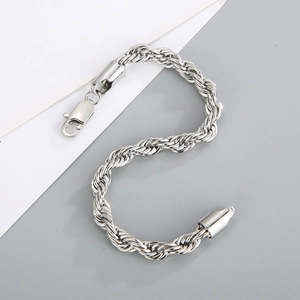 Detail of silver twisted rope chain bracelet with metallic luster and lobster clasp
