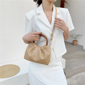 Fashionable khaki pleated cloud bag with round wooden handle and adjustable strap