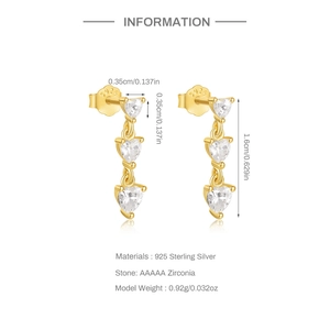 Detailed macro view of S925 sterling silver heart earrings with AAAAA cubic zirconia