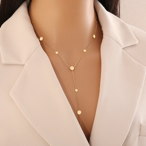 Elegant gold Y-shaped titanium steel necklace with heart pendants on a model