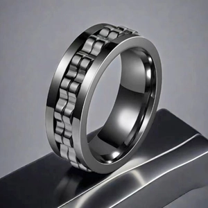 Detail view of the gunmetal rotatable chain ring made of polished titanium steel