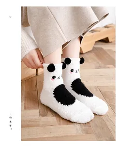 Detail of plush coral fleece panda socks featuring 3D ears and cute cartoon embroidery