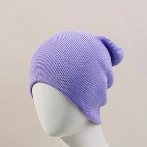 Detailed macro view of purple ribbed knit beanie fabric texture and elastic cuff