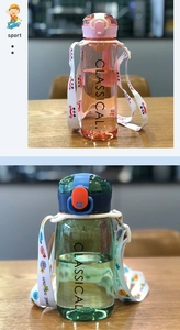 Detail of clear sports water bottles in pink and green with adjustable cartoon straps