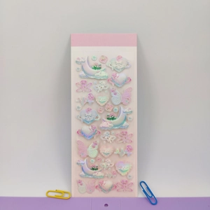 Macro view of 3D laser stickers featuring pink and purple moon and heart motifs