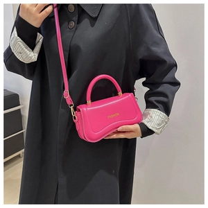 Minimalist rose pink leather crossbody bag with fashion gold print and curved base design