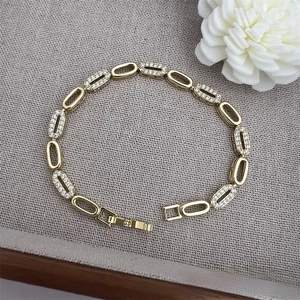 Macro shot of 18K gold plated chain link bracelet with sparkling cubic zirconia accents