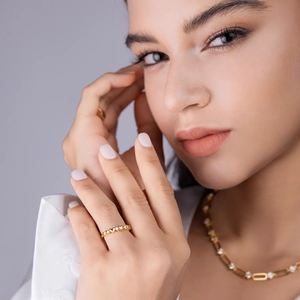 Elegant gold heart ring set with diamond chain necklace for women on grey background