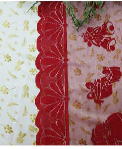 Close-up of red and gold Christmas table runner with embroidered bells and mesh lace