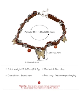 Detailed view of bohemian butterfly choker with silver beads and brown leather band