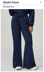 Detail of high-waist midnight blue wide-leg sweatpants with drawstring and side pocket