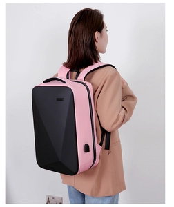 Pink and black hard shell business laptop backpack with USB port shown on a model
