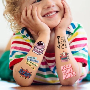 Waterproof cartoon reading temporary tattoos displayed on child's arm for party gift