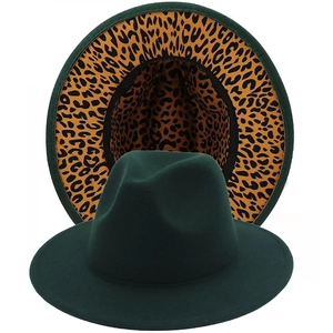 Detail view of dark green fedora hat with contrast leopard print lining and flat wide brim