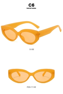 Front and side views of vintage orange cat eye sunglasses with translucent frames