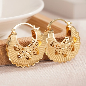 Golden hollow heart pattern hoop earrings in vintage ethnic fan-shaped metal design