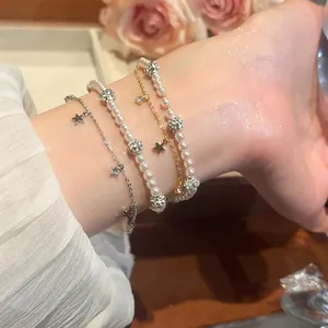 Double-layered beaded bracelet with elegant pearls, zircon stars and sparkling charms