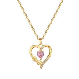 Luxurious gold heart necklace with pink gemstone and small crystals on a fine chain